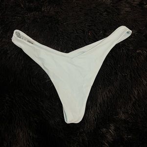 Light blue swim bottoms , cheeky